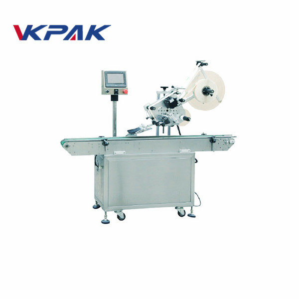 מכונת תיוג דביקה עצמית לצד החלק העליון של בריק קרח